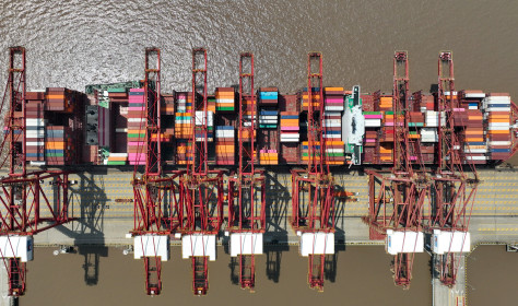  Ships carry out container loading and unloading operations at the Dapukou container Terminal at Zhoushan Port, Zhejiang province, China, April 9, 2024.