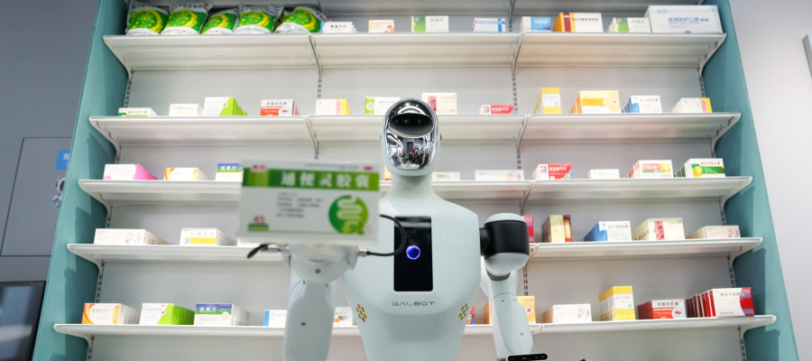 A Galbot humanoid robot plays the role of a shop assistant in a simulated pharmacy in Beijing Economic-Technological