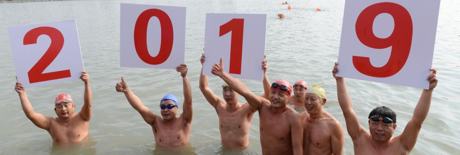 Chinese winter swimmers celebrate the new year's day of 2019 in the icy water of Chaohu lake in Anhui province. 