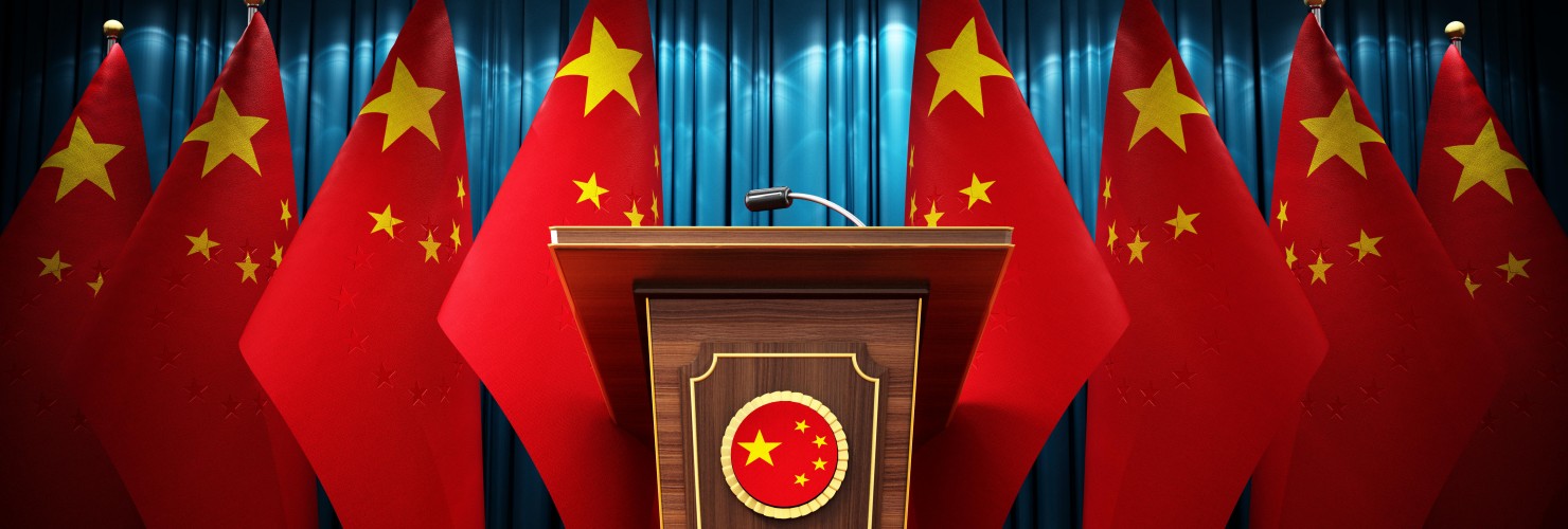 Group of Chinese flags standing next to lectern in the conference hall. 3D illustration. 