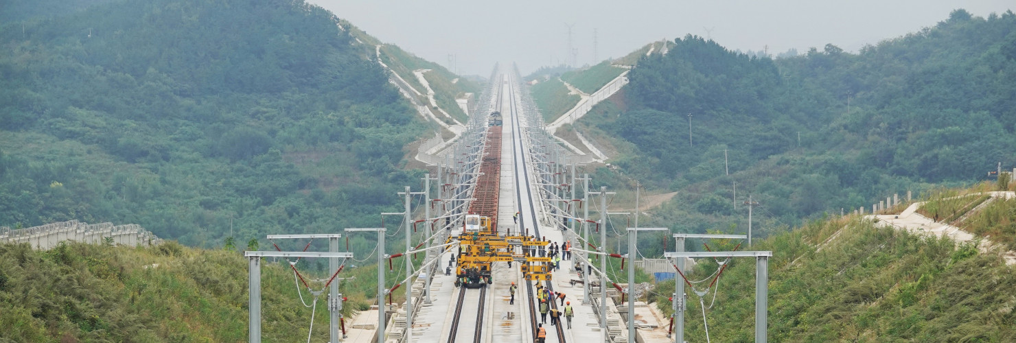 A track-laying train performs ballastless track-laying