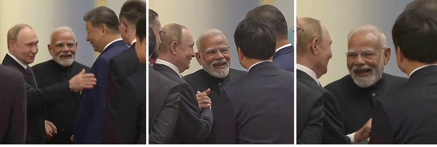 ussian President Vladimir Putin, left, Indian Prime Minister Narendra Modi, centre, and Chinese President Xi Jinping talk ahead of the Shanghai Cooperation Organization (SCO) summit