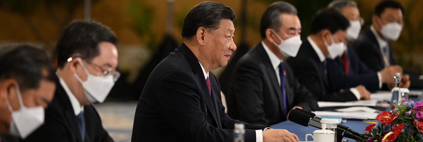 China's President Xi Jinping (C) attends a meeting on the sidelines of the G20 Leaders' Summit in Bali, Indonesia, 15 November 2022.