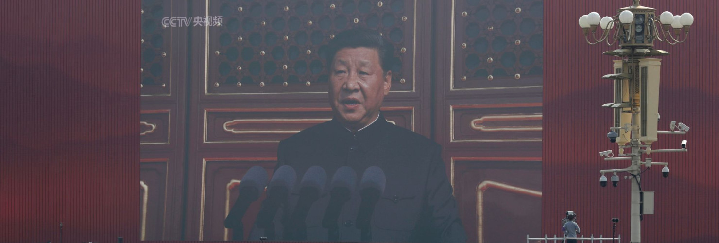 A huge screen shows Chinese President Xi Jinping delivering a speech at the start of a parade to mark the 70th anniversary of the founding of the People's Republic of China, in Beijing, Tuesday, Oct. 1, 2019. (AP Photo/Mark Schiefelbein)