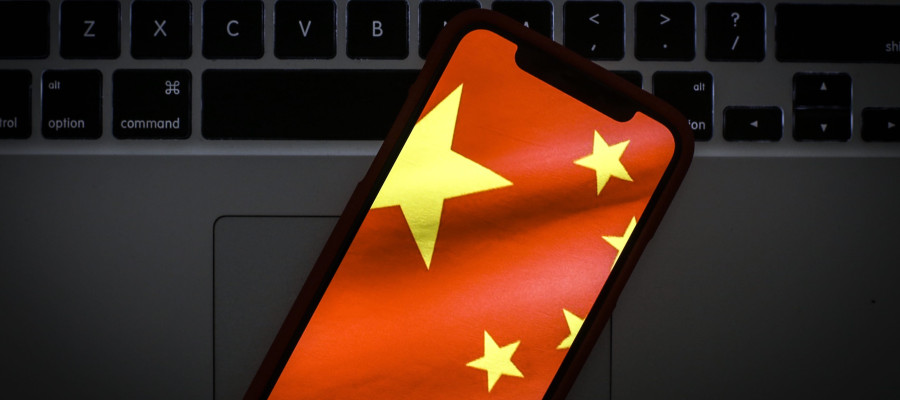 The Chinese flag is seen on a portable mobile device in this photo illustration