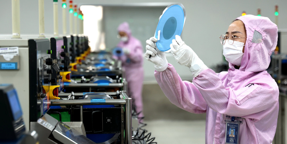  A worker is producing semiconductor products.