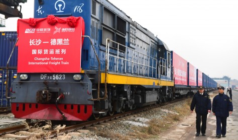 Chinese customs officers check a freight train of China Railway Express running from Changsha to Tehran. 
