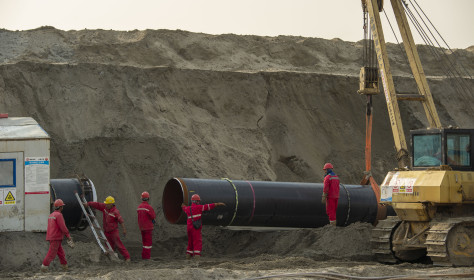 Workers labor at the construction site of the China-Russia east route natural gas pipeline in Hai'an in eastern China's Jiangsu province Saturday, March 12, 2022.