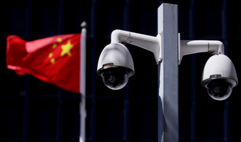 Security cameras in front of a Chinese flag