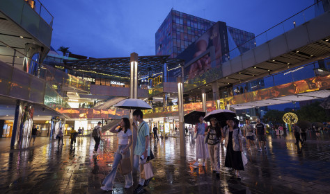 People shop at Taikoo Li Sanlitun in Beijing, China, Tuesday, July 2, 2024.
