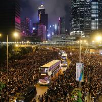 Hong Kong demonstrators give way to busses at Harcourt Road on 16 June 2019. According to organizers, nearly 2 million people turned out that day. Photo: Wikipedia user – Wpcpey.