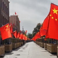 An empty street in Xinjiang with Chinese flags