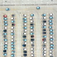energy vehicles out of a parking lot at a logistics park in Liuzhou