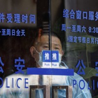 A man stands in police station, in Shanghai, China, 06 July 2022.