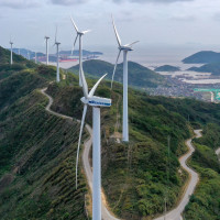 An aerial photo shows wind turbines turning under the action of sea breeze at Qushandao Wind Farm in Zhoushan City, Zhejiang Province, China, Nov 1, 2022.
