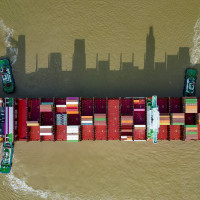 An aerial photo shows a container ship loaded with containers leaving the wharf at Yangshan Deep Water Port Area of Shanghai Port in Shanghai, China, Sept 11, 2022.