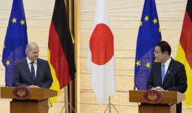 German Chancellor Olaf Scholz, left, listens to his Japanese counterpart Fumio Kishida during a joint press conference in Tokyo, Thursday, April 28, 2022.