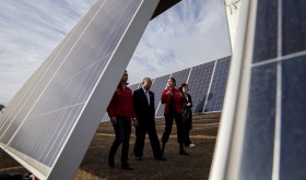 China's Xie Zhenhua, second from left, walks with Chile's Environment Minister Carolina Schmidt, third from left, and Chile's Energy Minister Juan Carlos Jobet, far left, as they tour the Quilapilún solar plant, a joint venture by China and Chile, in Colina, Chile, Tuesday, Aug. 20, 2019.