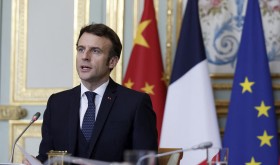 French President Emmanuel Macron attends a video-conference with German Chancellor Olaf Scholz and Chinese President Xi Jinping to discuss the Ukraine crisis at the Elysee Palace in Paris, Tuesday, March 8, 2022. 