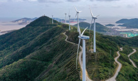 An aerial photo shows wind turbines turning under the action of sea breeze at Qushandao Wind Farm in Zhoushan City, Zhejiang Province, China, Nov 1, 2022.
