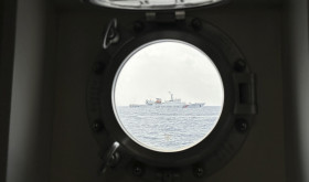 A Chinese coast guard ship blocks Philippine coast guard ship, BRP Sindangan as it tried to head towards Second Thomas Shoal at the disputed South China Sea during rotation and resupply mission on Wednesday, Oct. 4, 2023.