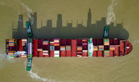 An aerial photo shows a container ship loaded with containers leaving the wharf at Yangshan Deep Water Port Area of Shanghai Port in Shanghai, China, Sept 11, 2022.