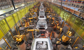 Robots work on a vehicle assembly line in east China's Shandong province
