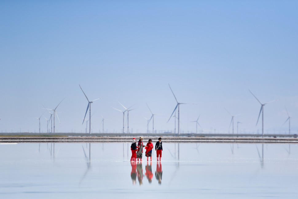 People in front of wind turbine